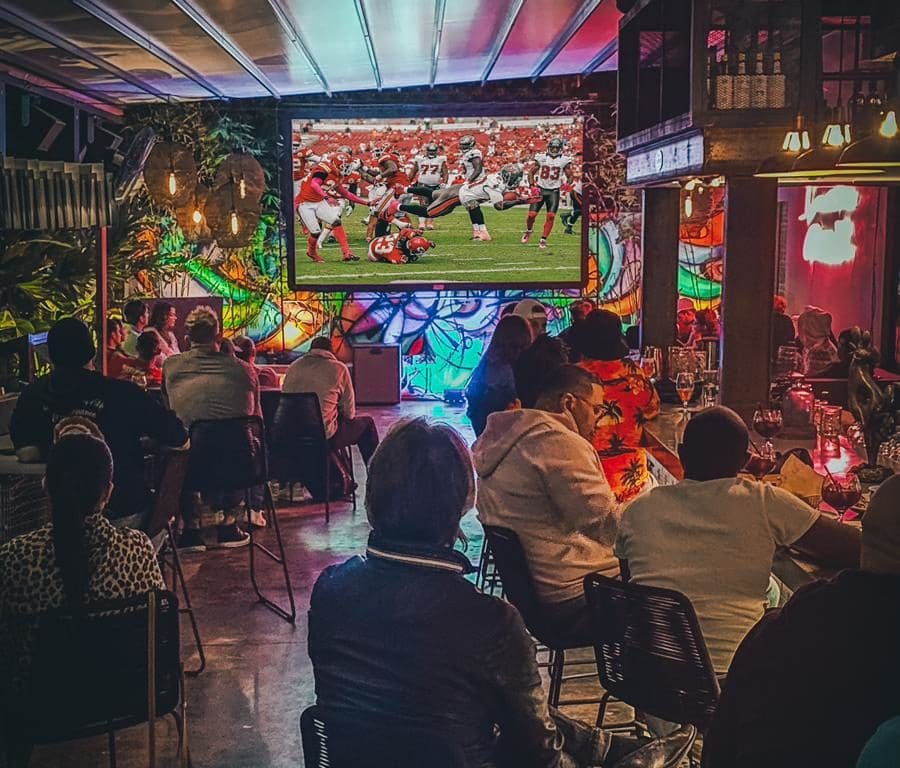 Onlookers watch the game at Le Chick