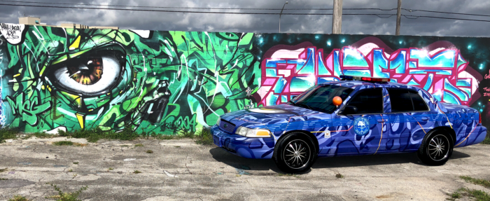 The final #MPDArtCar in front of Abstrk's work in the RC Cola Plant.