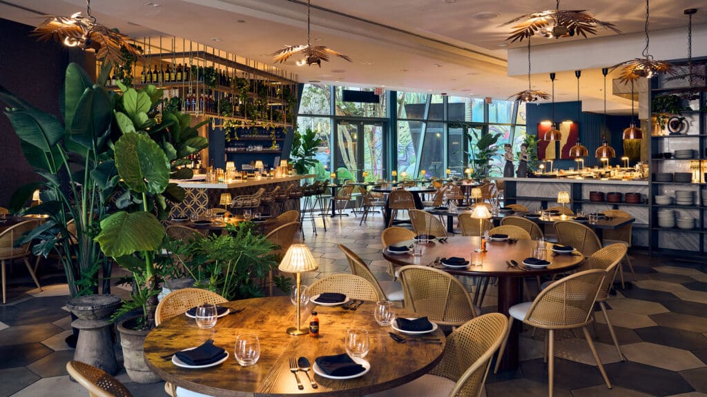 Wayan Miami restaurant space interior, tables, chairs, bar and overall dining space.
